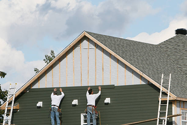 Professional Siding Installation technician working in Houston, TX